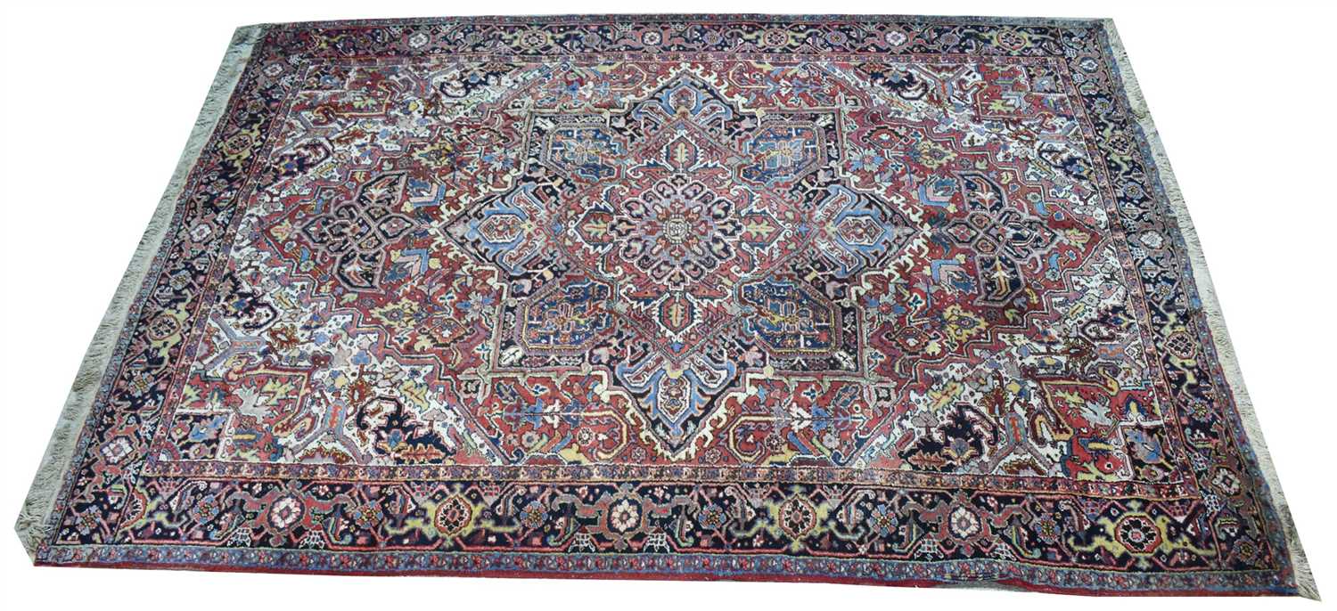 Lot 894 - Heriz carpet, with geometric floral design,...