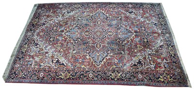 Lot 671 - Heriz carpet, with geometric floral design,...