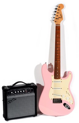 Lot 151 - A Fender Squier Bullet pink Stratocaster and amp