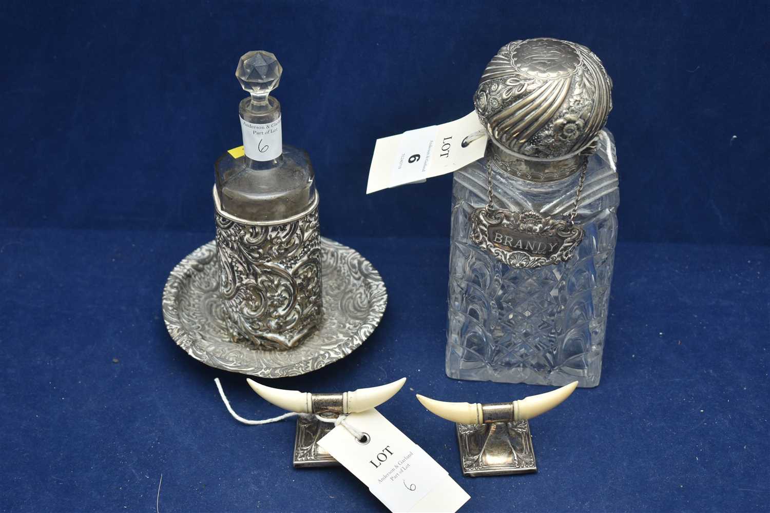 Lot 6 - Silver mounted knife rests, and two decanters