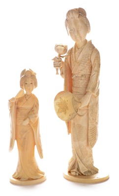 Lot 411 - Two Japanese carved ivory Bijin.