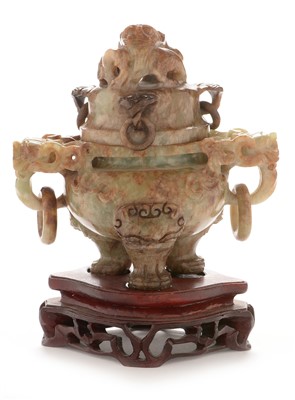 Lot 386 - A Chinese green hardstone censer and cover, wood stand