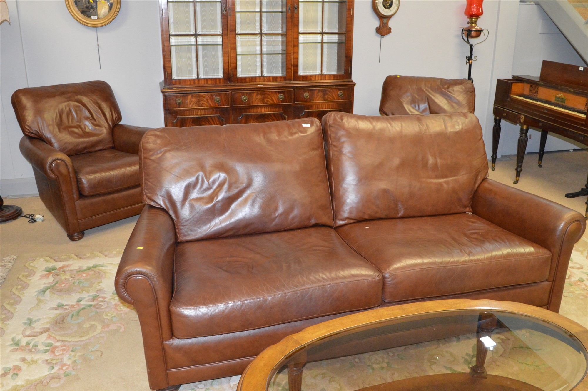 Lot 671 Leather three piece suite