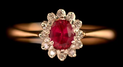 Lot 171 - Ruby and diamond cluster ring