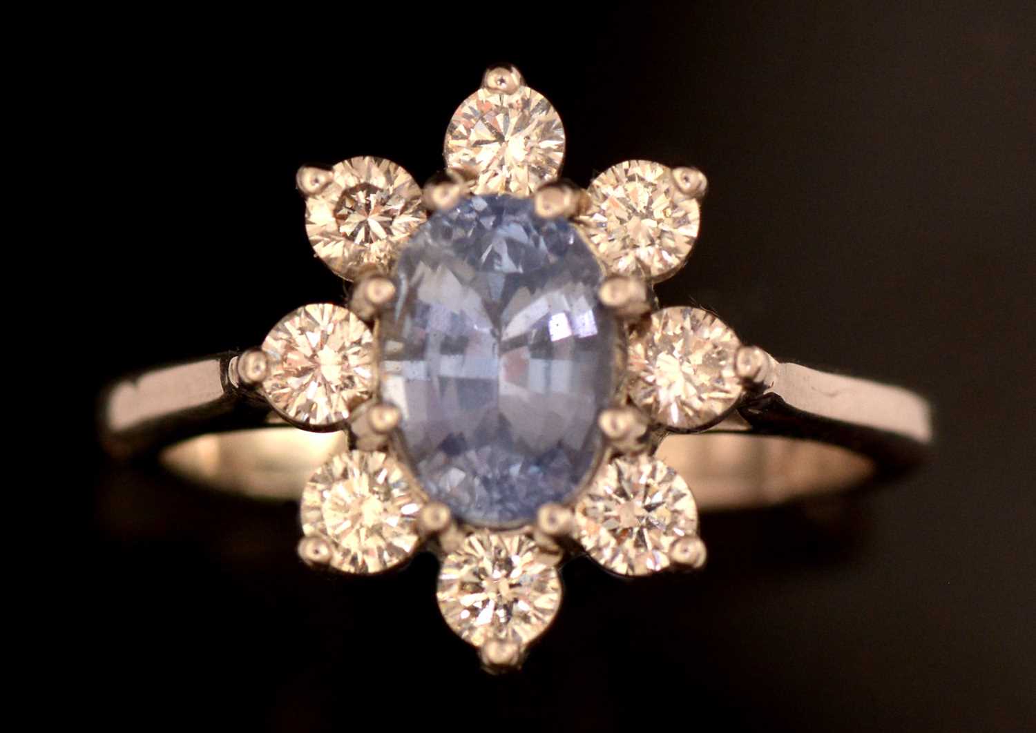 Lot 160 - Sapphire and diamond cluster ring
