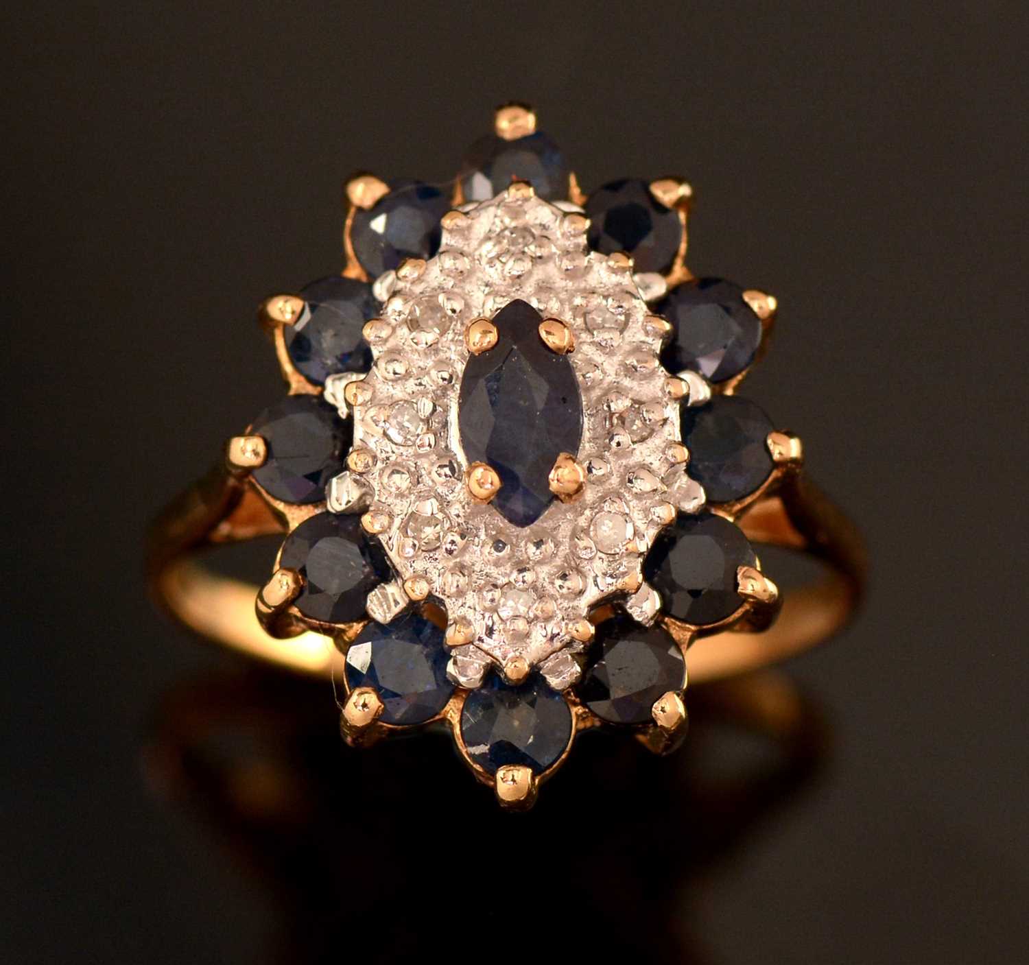 Lot 166 - Sapphire and diamond cluster ring