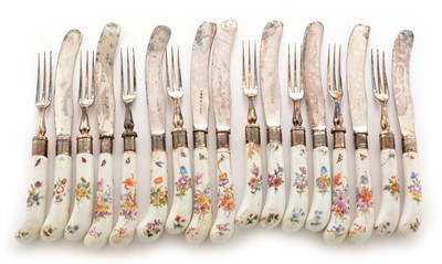 Lot 422 - Nine mid 18th Century Chelsea pistol grip table knives and eight matching forks.