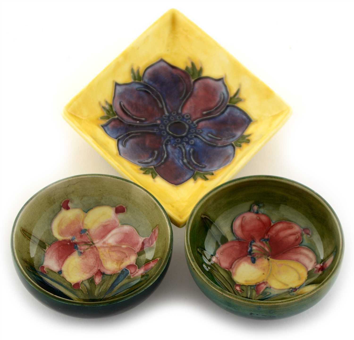 Lot 1532 - Two Moorcroft small bowls and a yellow diamond shaped dish.