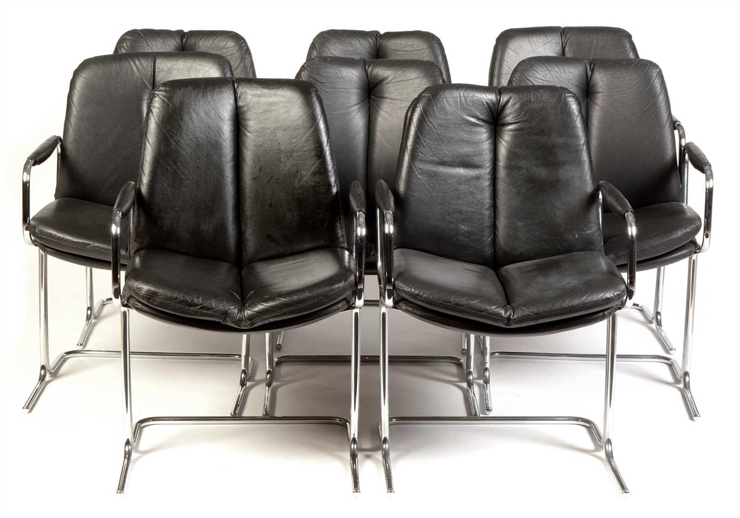 Lot 1585 - Tim Bates for Pieff: eight  'Eleganza' black leather and chrome chairs.