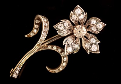 Lot 179 - Diamond set flower brooch