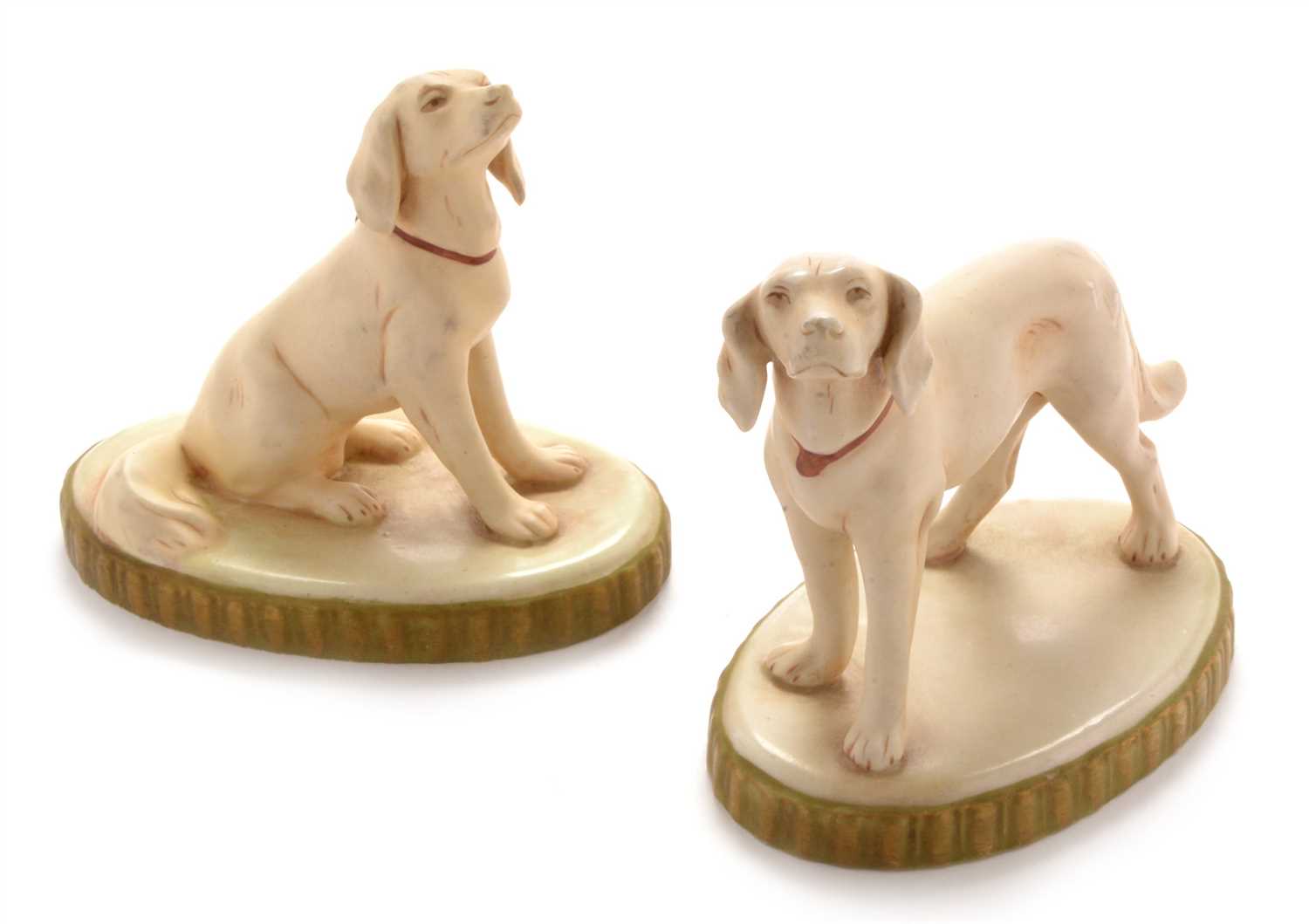 Lot 611 - Two Royal Dux figures of dogs