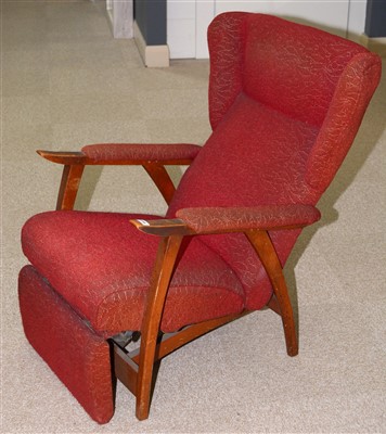 Lot 1598 - A red upholstered reclining armchair.