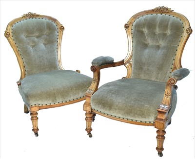 Lot 1142 - A pair of Victorian walnut balloon back lady's and gentleman's chairs.