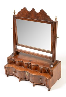 Lot 1066 - A Georgian walnut swing framed toilet mirror