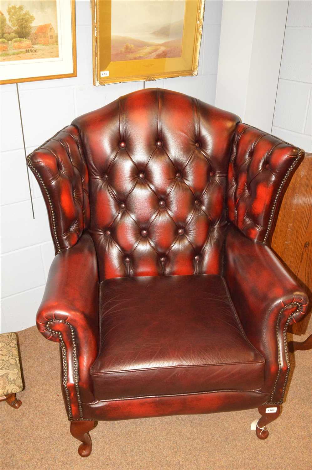 Lot 1180 - Wing back Chesterfield chairs