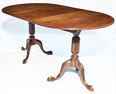 Lot 1176 - A mahogany twin pedestal D-end dining table.