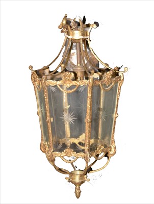 Lot 1020 - A giltmetal and cut glass hall lantern.