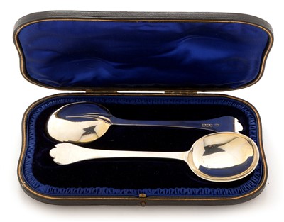 Lot 275 - A pair of silver trefid spoons