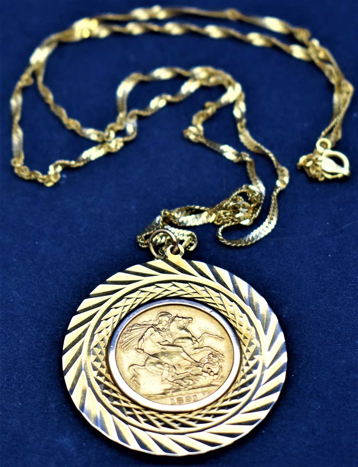 Lot 768 - Gold sovereign on mount and chain