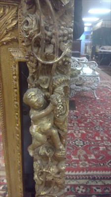 Lot 1034 - A Baroque style giltwood wall mirror