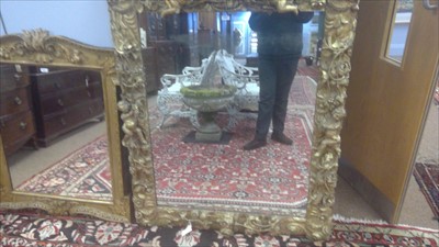 Lot 1034 - A Baroque style giltwood wall mirror