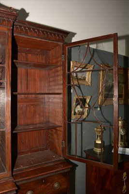 Lot 1226 - A George III mahogany breakfront secretaire bookcase.