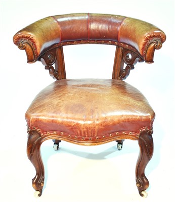 Lot 1244 - A Victorian oak and leather upholstered tub shaped library chair