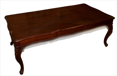 Lot 1107 - An American walnut extending dining table.