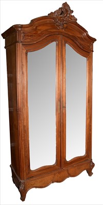 Lot 1120 - A 19th Century French walnut armoire.