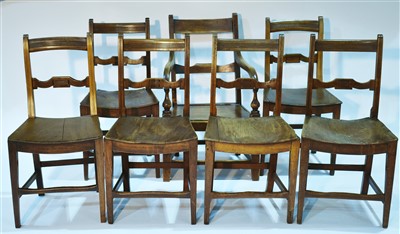 Lot 1190 - A set of six early 19th Century fruitwood dining chairs; and a rustic armchair.