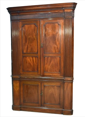 Lot 1218 - A large George III mahogany corner cabinet