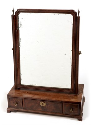 Lot 1055 - A Georgian mahogany swing framed toilet mirror.