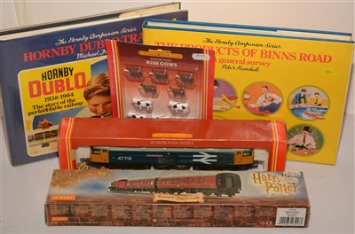 Lot 1399 - Hornby locomotive, Hogwarts coach; and two books on Hornby products.