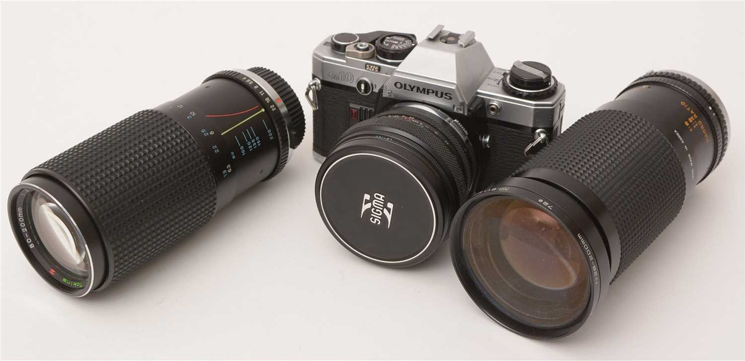 Lot 1431 - An Olympus camera and various lenses.