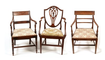 Lot 1197 - Three Georgian mahogany elbow chairs.