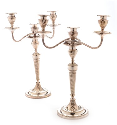 Lot 250 - A pair of plated candelabra