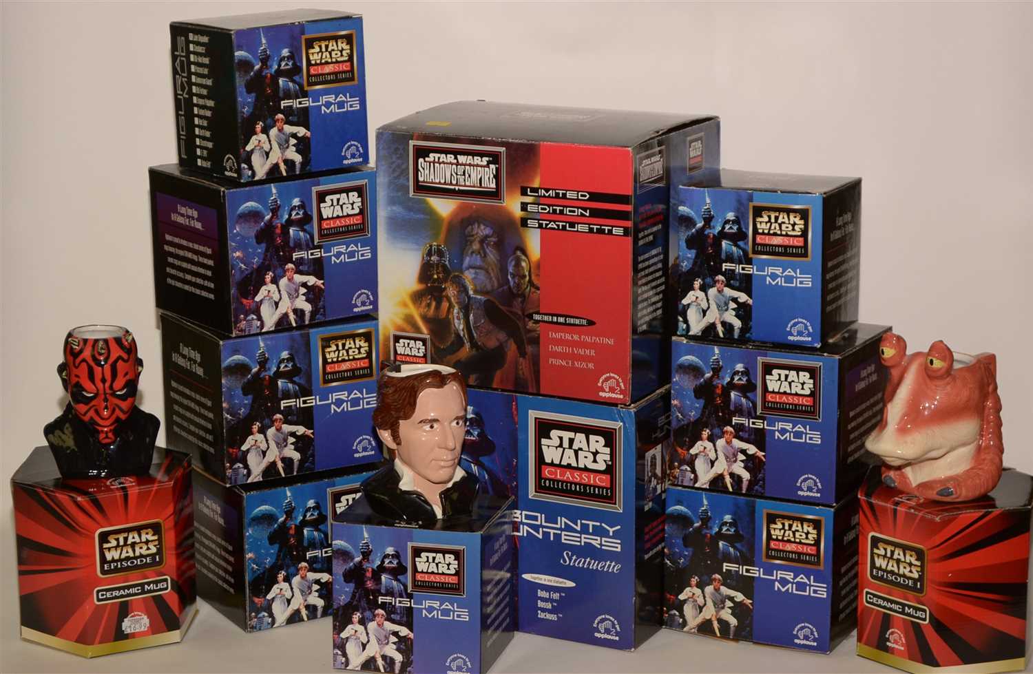 Lot 1225 - Star Wars mugs and two statuettes.