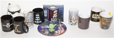Lot 1225 - Star Wars mugs and two statuettes.