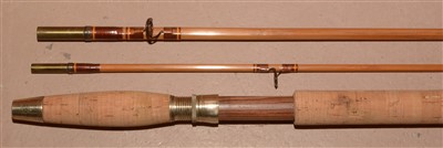 Lot 1592 - A trout fly fishing rod and green slip.