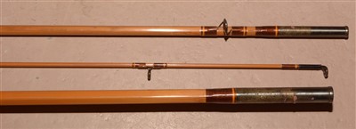 Lot 1592 - A trout fly fishing rod and green slip.