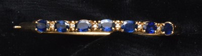 Lot 77 - A sapphire bangle
