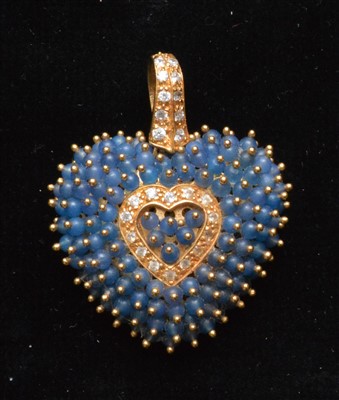 Lot 74 - A sapphire and white sapphire pendant