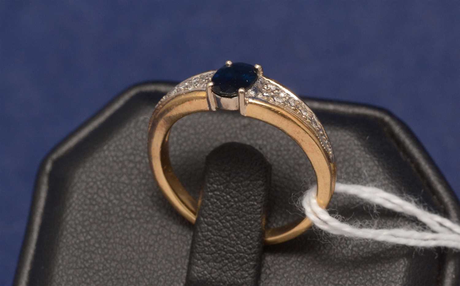 Lot 585 - Sapphire and diamond ring