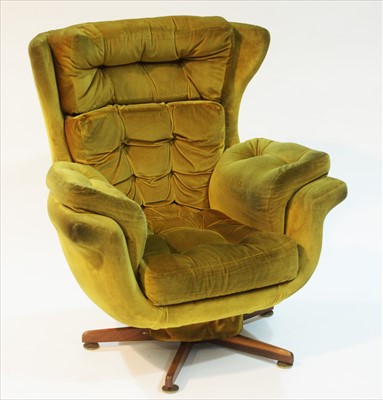 Lot 967 - A Mid-20th Century swivel and reclining armchair.