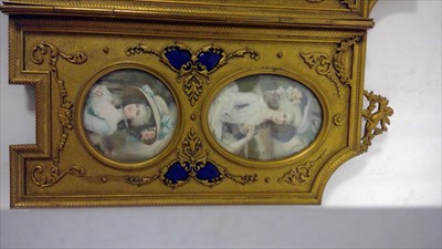 Lot 1064 - An ornate French ormolu and enamel three-fold table screen.
