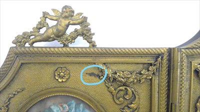 Lot 1064 - An ornate French ormolu and enamel three-fold table screen.