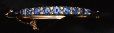 Lot 78 - Sapphire and diamond bangle
