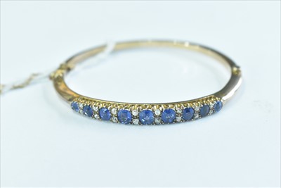 Lot 78 - Sapphire and diamond bangle