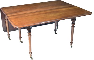 Lot 1202 - An early 19th century mahogany drop-leaf dining table