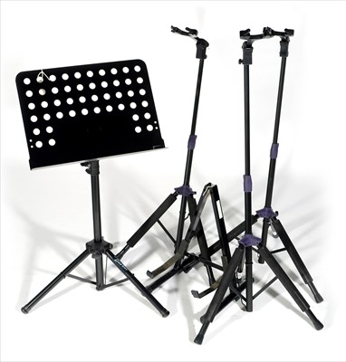 Lot 60 - Four guitars stands, music stand